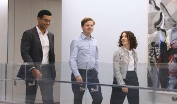 business people walking down a hallway