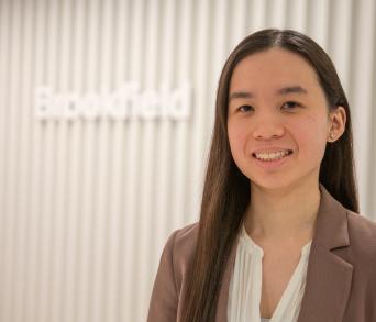 portrait of Sophia Infront of Brookfield logo