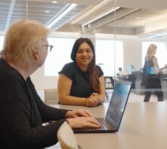 Two women in a meeting room