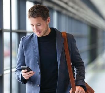 Smiling Man looking at his phone